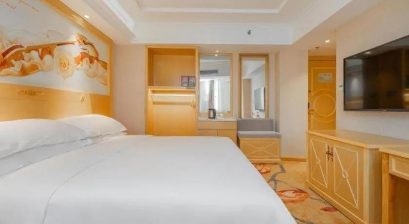 Bed in Vienna Hotel Guangxi Hezhou Guposhan Suifeng