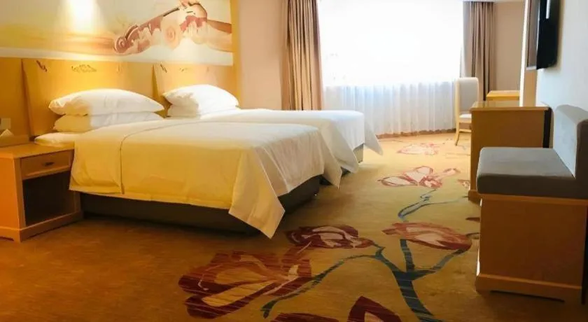 Bed in Vienna Hotel Guangxi Hezhou Guposhan Suifeng