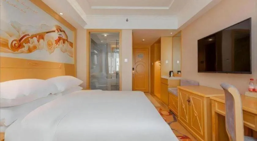 Bed in Vienna Hotel Guangxi Hezhou Guposhan Suifeng