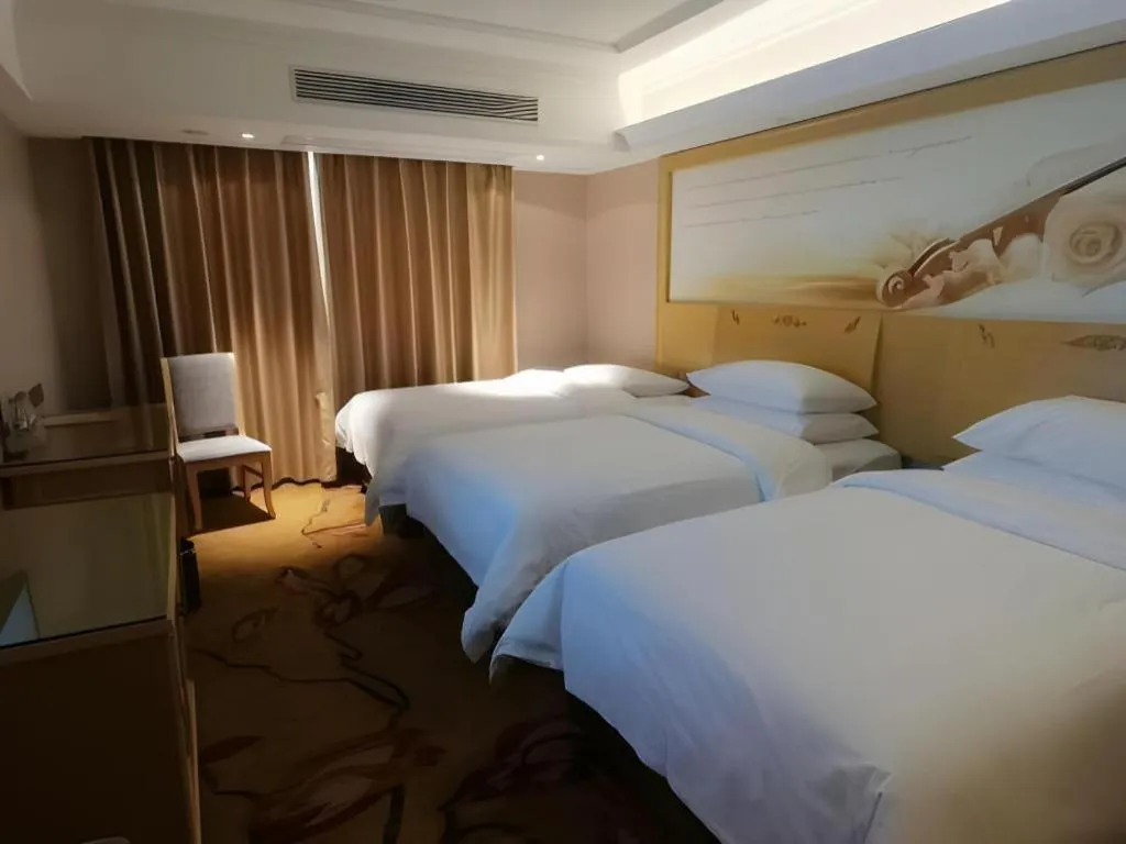 Bed in Vienna Hotel Guangxi Hezhou Guposhan Suifeng