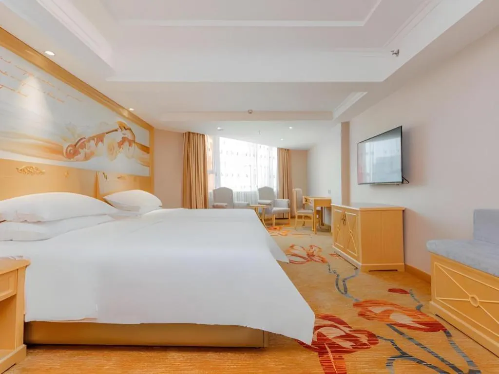 Bed in Vienna Hotel Guangxi Hezhou Guposhan Suifeng