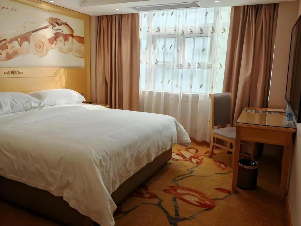 Bed in Vienna Hotel Guangxi Hezhou Guposhan Suifeng