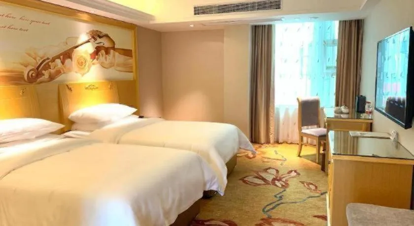 Bed in Vienna Hotel Guangxi Hezhou Guposhan Suifeng