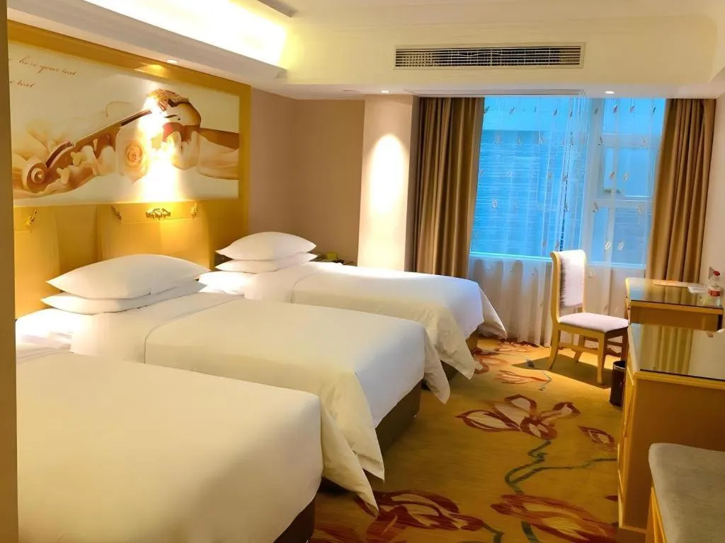 Bed in Vienna Hotel Guangxi Hezhou Guposhan Suifeng