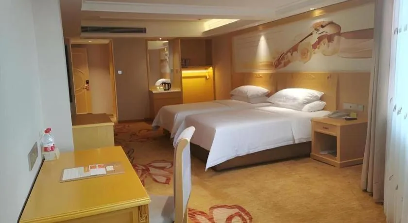 Bed in Vienna Hotel Guangxi Hezhou Guposhan Suifeng