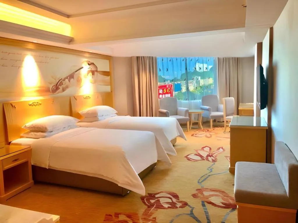 Bed in Vienna Hotel Guangxi Hezhou Guposhan Suifeng