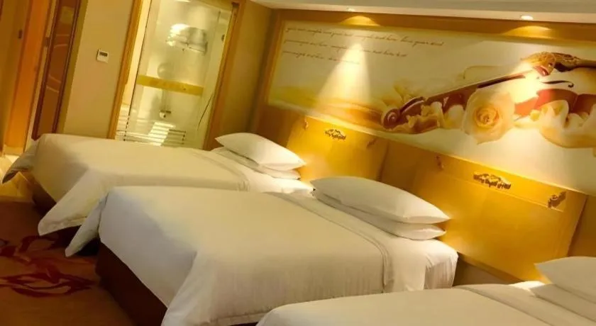 Bed in Vienna Hotel Guangxi Hezhou Guposhan Suifeng