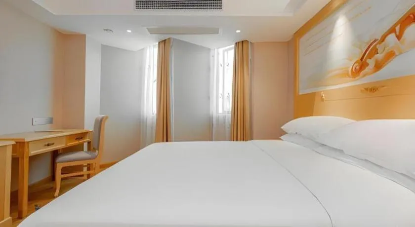 Bed in Vienna Hotel Guangxi Hezhou Guposhan Suifeng