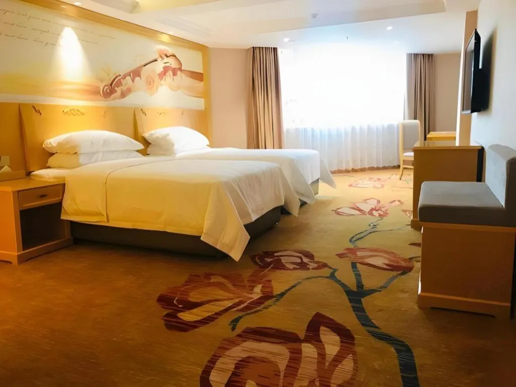 Bed in Vienna Hotel Guangxi Hezhou Guposhan Suifeng