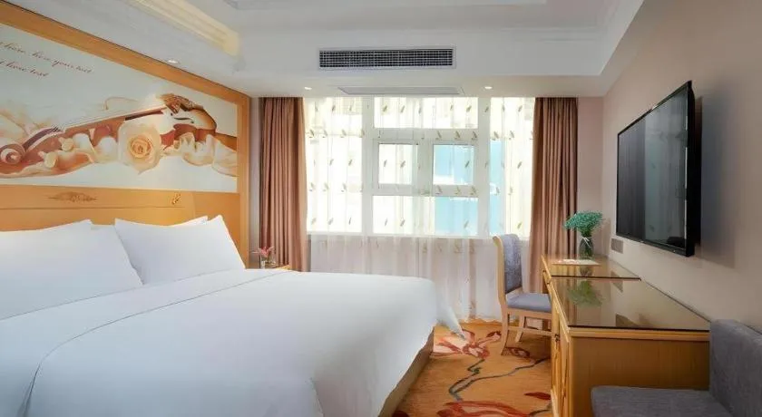 Bed in Vienna Hotel Guangxi Hezhou Guposhan Suifeng
