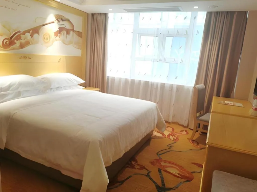 Bed in Vienna Hotel Guangxi Hezhou Guposhan Suifeng