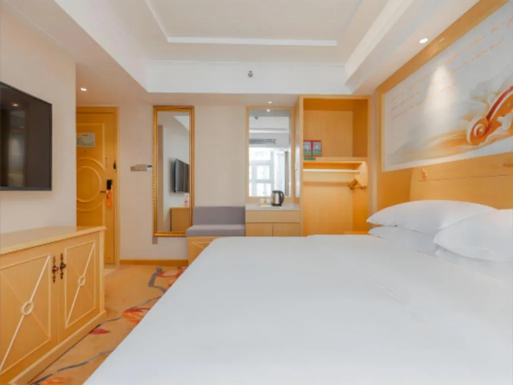 Bed in Vienna Hotel Guangxi Hezhou Guposhan Suifeng