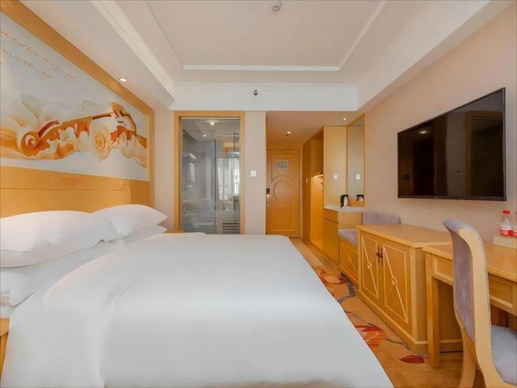 Bed in Vienna Hotel Guangxi Hezhou Guposhan Suifeng