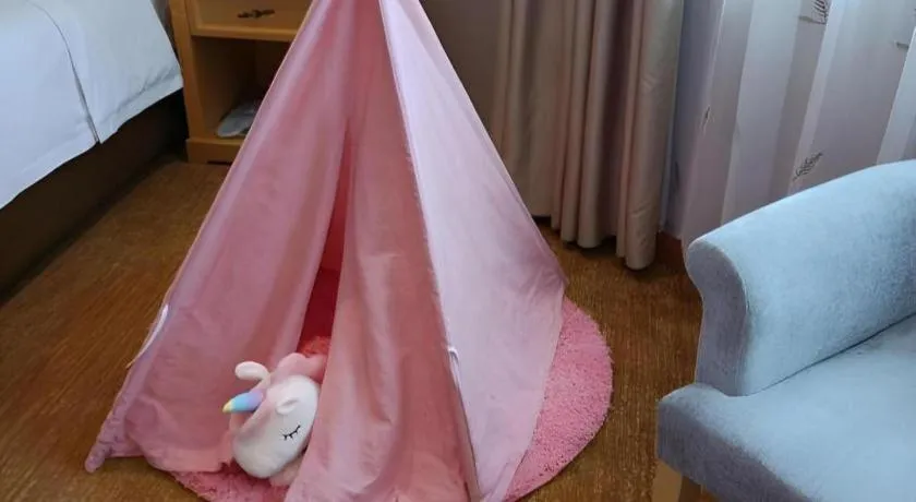 Bed in Vienna Hotel Guangxi Hezhou Guposhan Suifeng