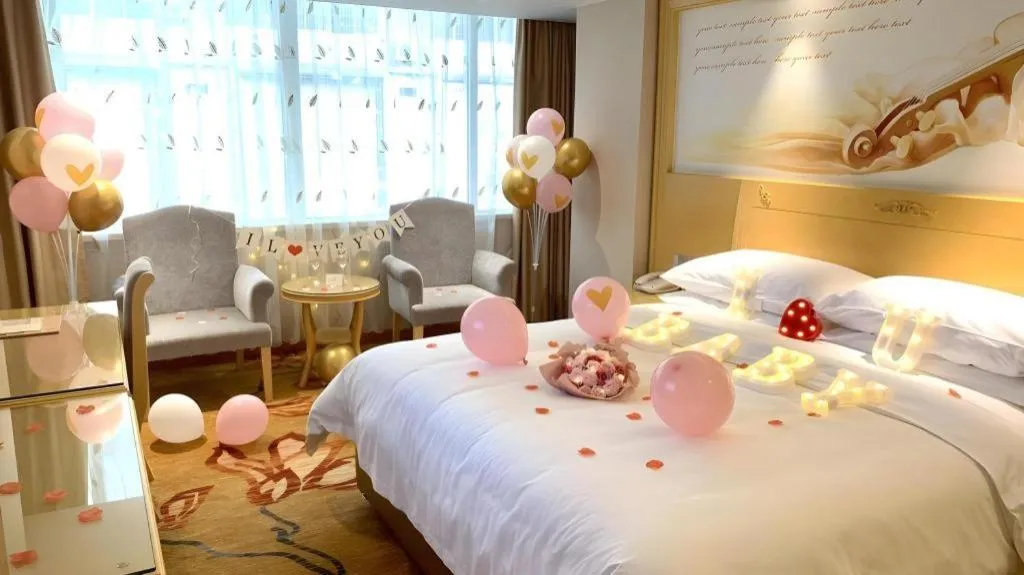 Bed in Vienna Hotel Guangxi Hezhou Guposhan Suifeng