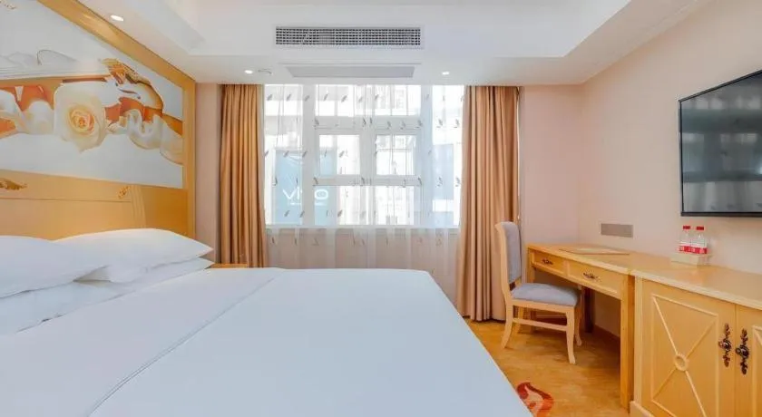 Bed in Vienna Hotel Guangxi Hezhou Guposhan Suifeng