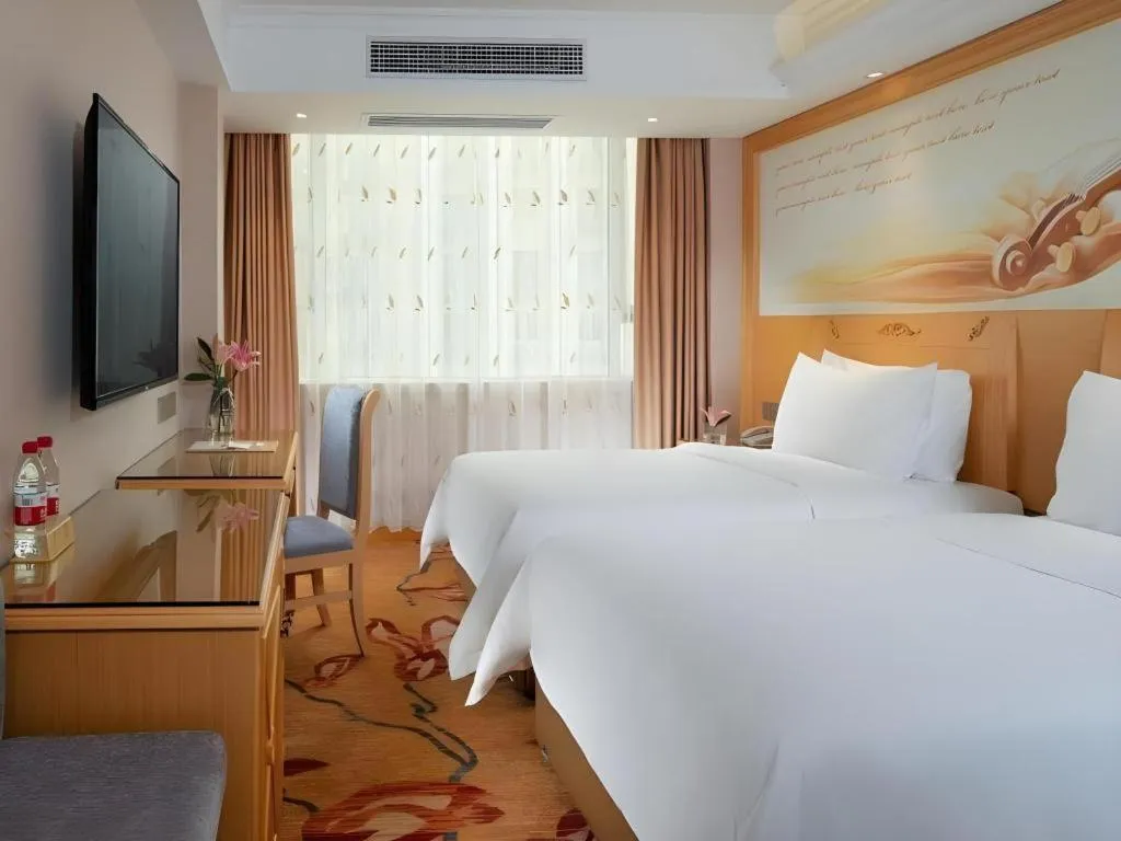 Bed in Vienna Hotel Guangxi Hezhou Guposhan Suifeng