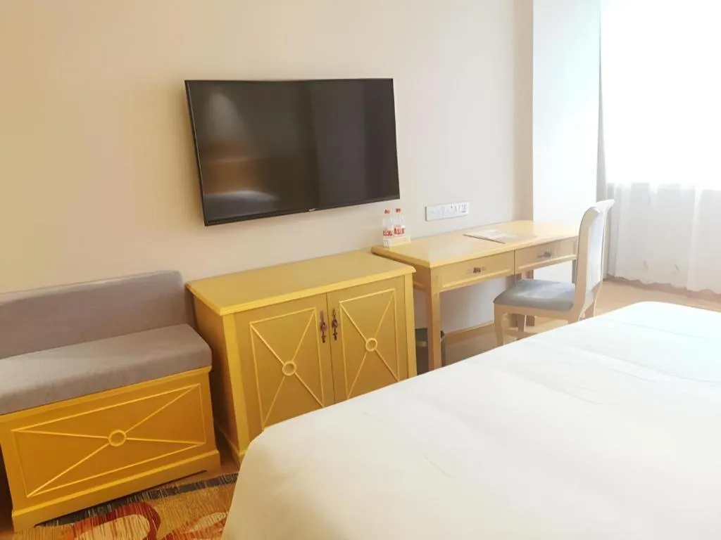 Bed in Vienna Hotel Guangxi Hezhou Guposhan Suifeng