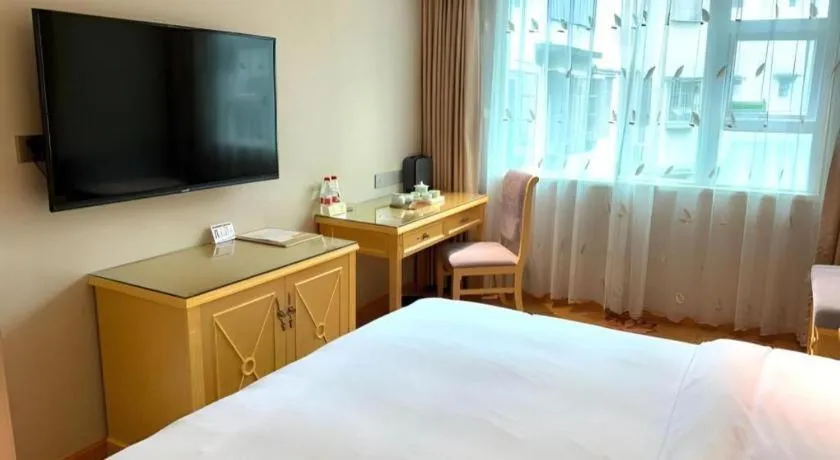 Bed in Vienna Hotel Guangxi Hezhou Guposhan Suifeng