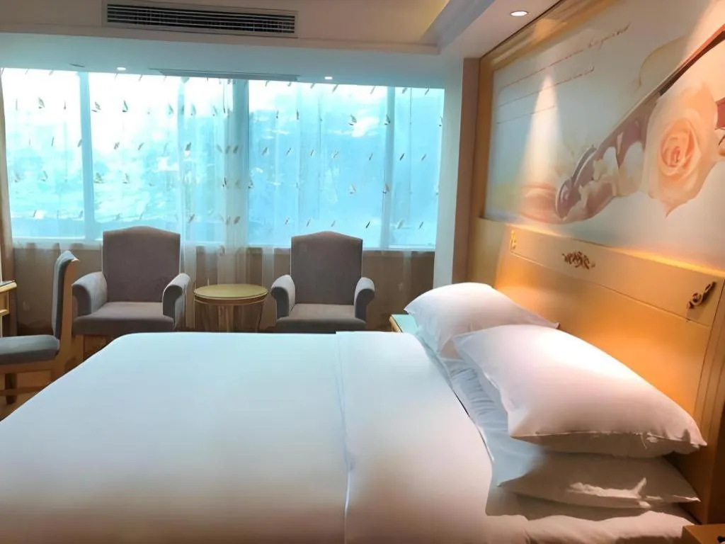 Bed in Vienna Hotel Guangxi Hezhou Guposhan Suifeng