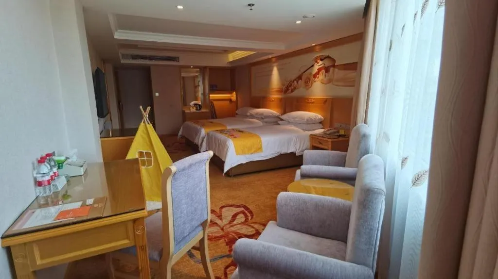 Bed in Vienna Hotel Guangxi Hezhou Guposhan Suifeng