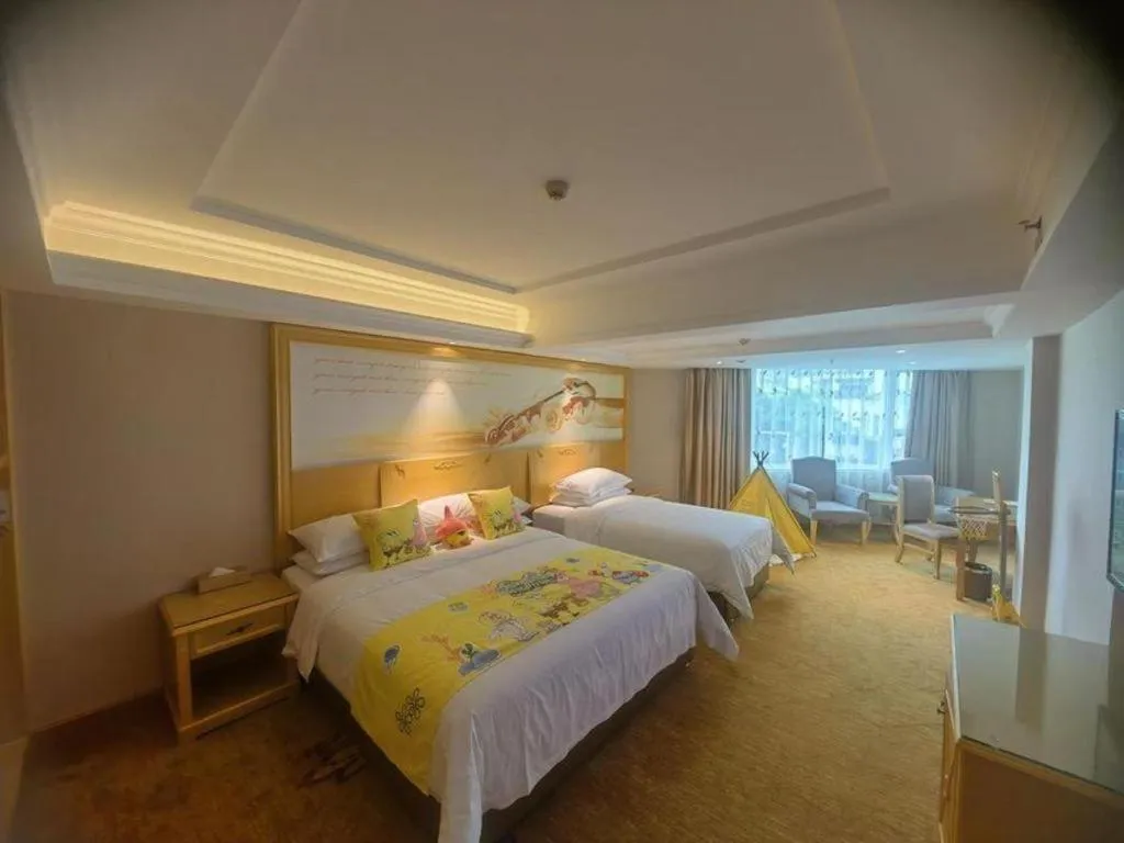 Bed in Vienna Hotel Guangxi Hezhou Guposhan Suifeng