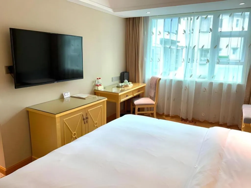 Bed in Vienna Hotel Guangxi Hezhou Guposhan Suifeng