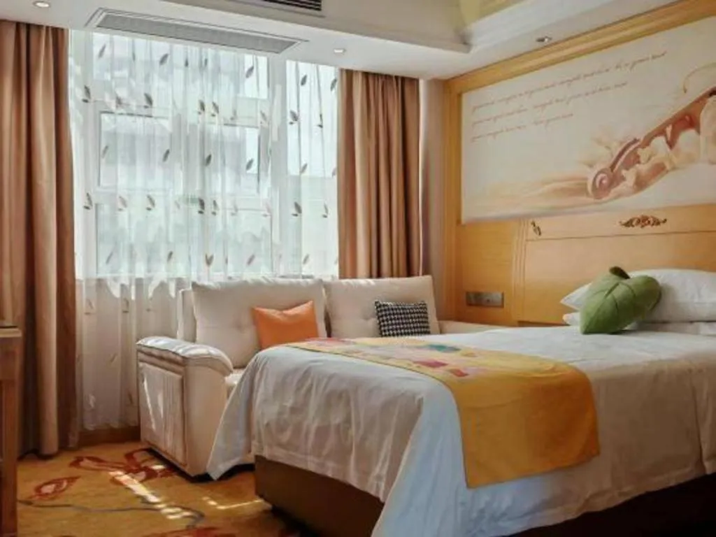 Bed in Vienna Hotel Guangxi Hezhou Guposhan Suifeng