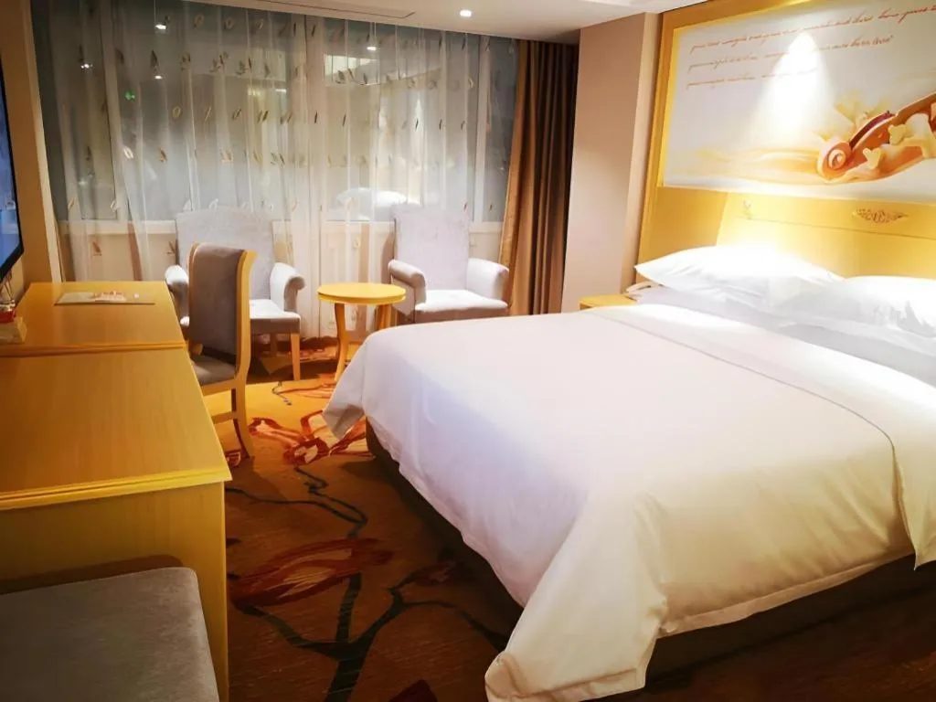 Bed in Vienna Hotel Guangxi Hezhou Guposhan Suifeng
