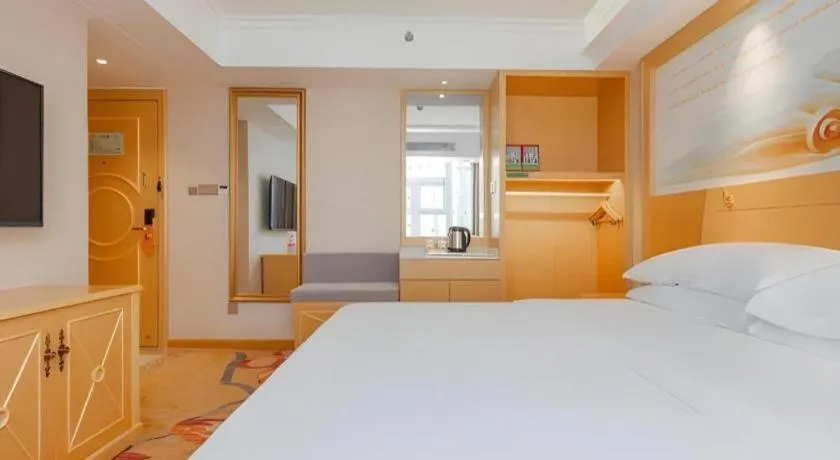 Bed in Vienna Hotel Guangxi Hezhou Guposhan Suifeng