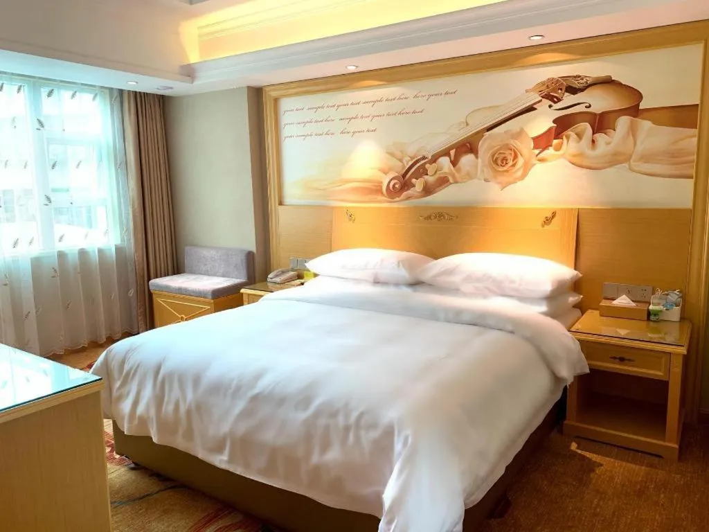 Bed in Vienna Hotel Guangxi Hezhou Guposhan Suifeng