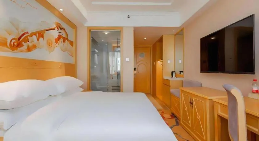 Bed in Vienna Hotel Guangxi Hezhou Guposhan Suifeng