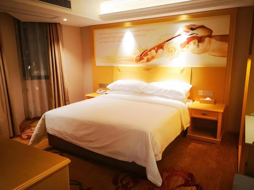 Bed in Vienna Hotel Guangxi Hezhou Guposhan Suifeng