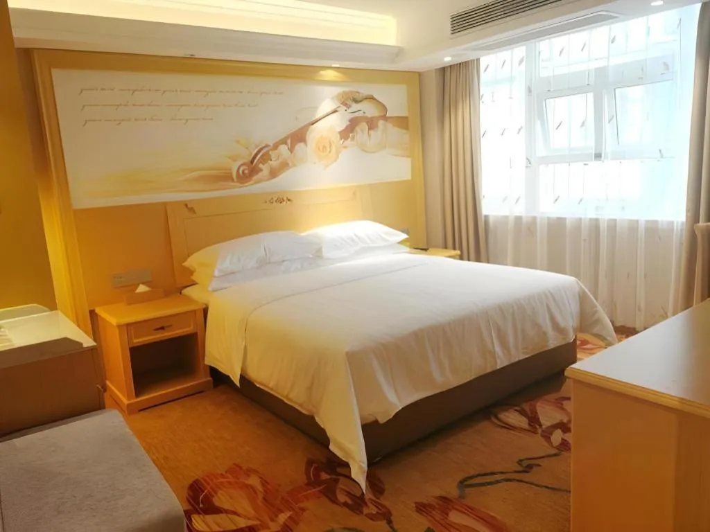 Bed in Vienna Hotel Guangxi Hezhou Guposhan Suifeng