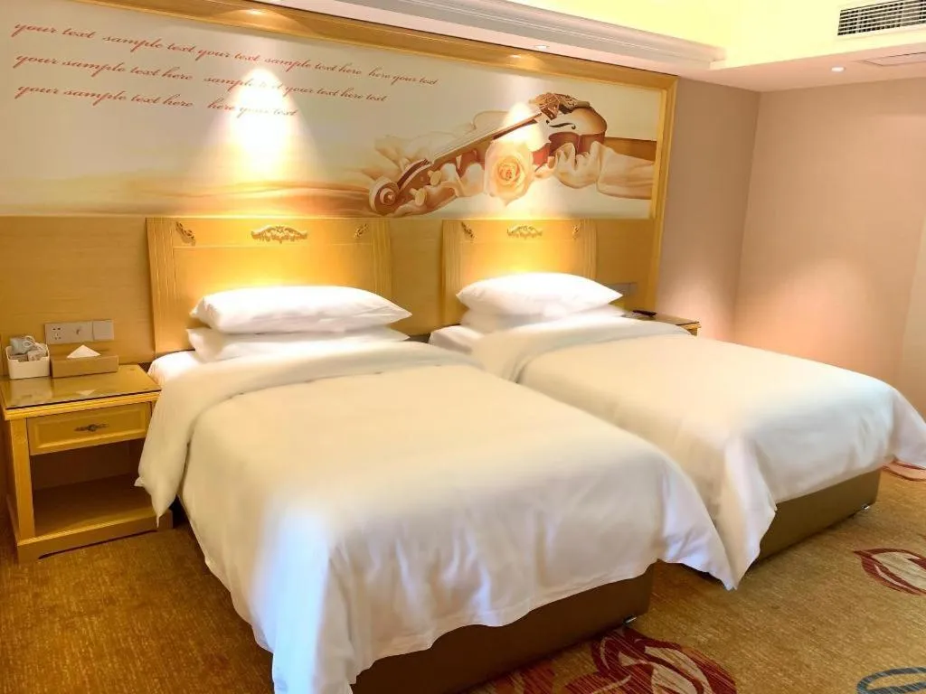 Bed in Vienna Hotel Guangxi Hezhou Guposhan Suifeng