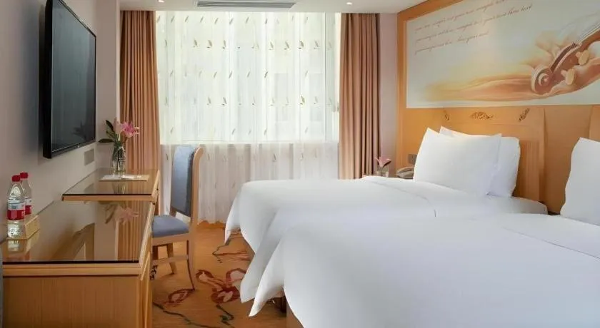 Bed in Vienna Hotel Guangxi Hezhou Guposhan Suifeng