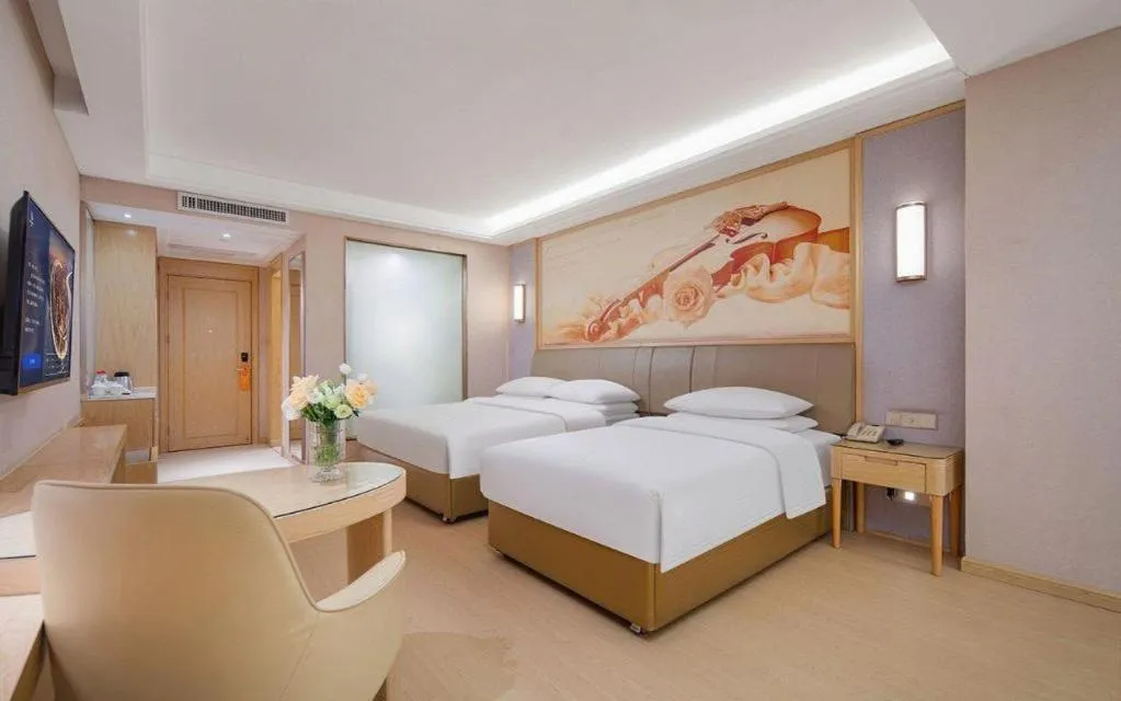 Bed in Vienna Hotel Guizhou Liupanshui Shuicheng Ancient Town