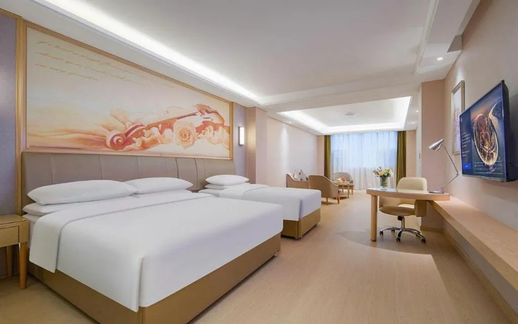 Bed in Vienna Hotel Guizhou Liupanshui Shuicheng Ancient Town