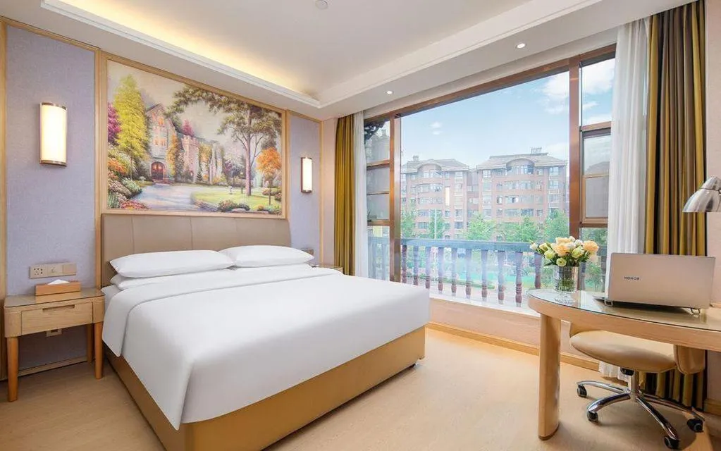 Bed in Vienna Hotel Guizhou Liupanshui Shuicheng Ancient Town