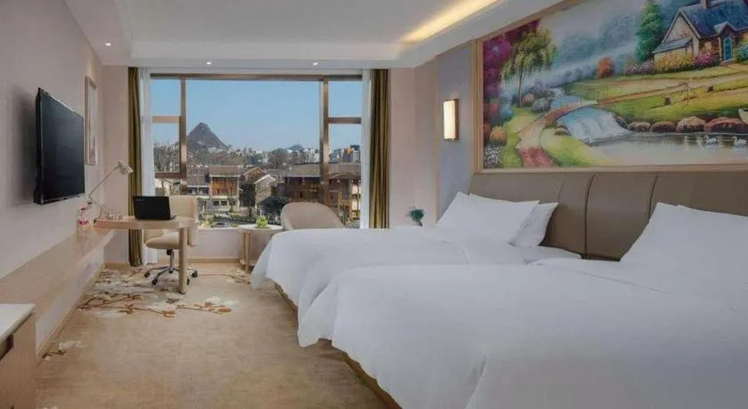 Bed in Vienna Hotel Guizhou Liupanshui Shuicheng Ancient Town