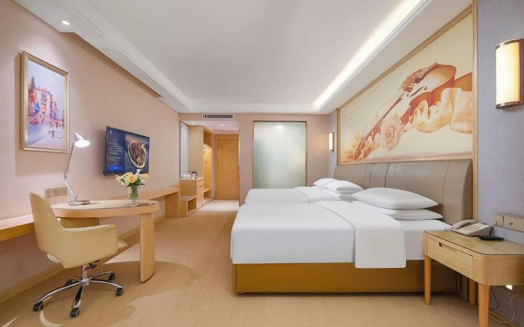 Bed in Vienna Hotel Guizhou Liupanshui Shuicheng Ancient Town