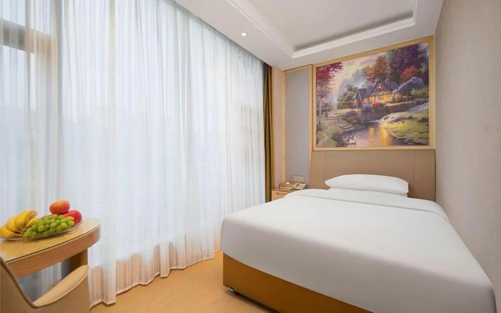 Bed in Vienna Hotel Guizhou Liupanshui Shuicheng Ancient Town