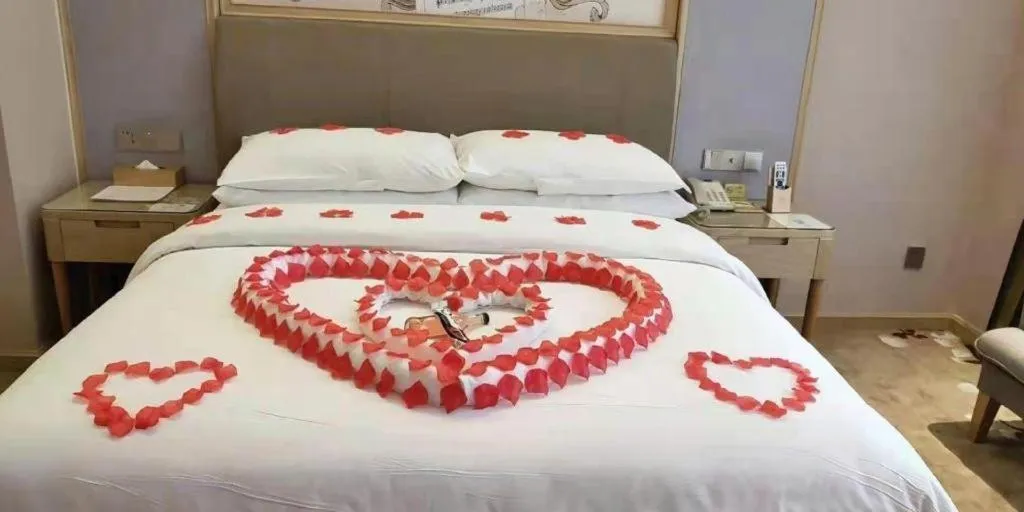 Bed in Vienna Hotel Guizhou Liupanshui Shuicheng Ancient Town