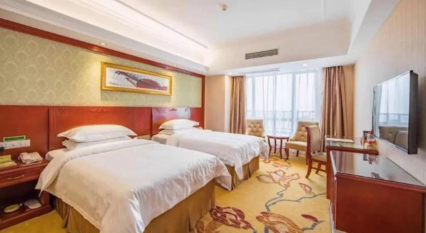 Bed in Vienna Hotel Guangxi Guilin Xing'an