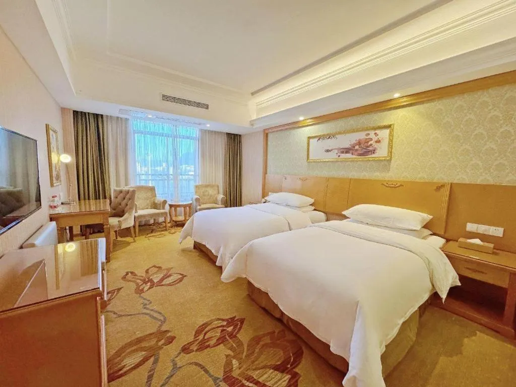 Bed in Vienna Hotel Guangxi Guilin Xing'an
