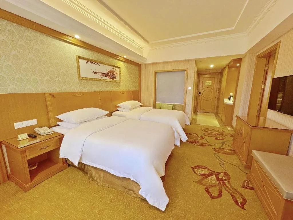 Bed in Vienna Hotel Guangxi Guilin Xing'an