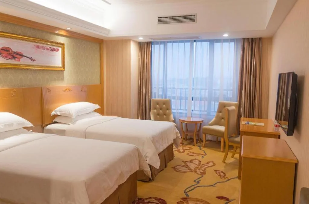 Bed in Vienna Hotel Guangxi Guilin Xing'an