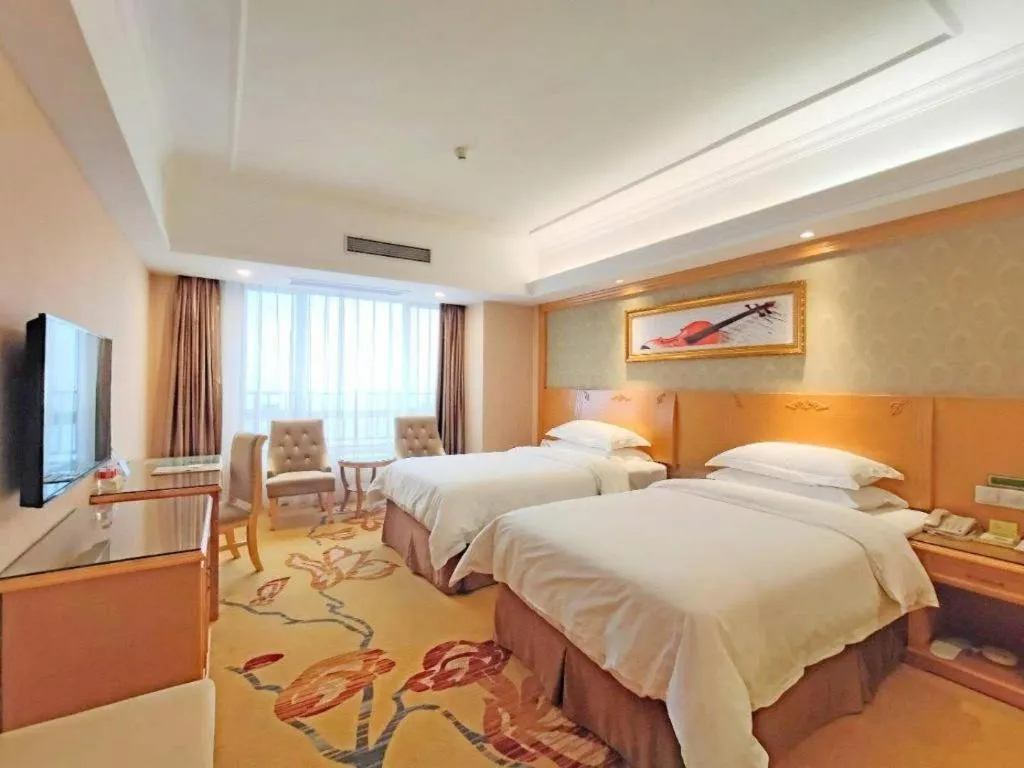 Bed in Vienna Hotel Guangxi Guilin Xing'an