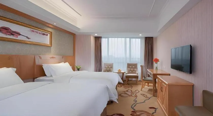 Bed in Vienna Hotel Guangxi Guilin Xing'an