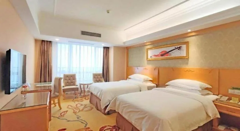 Bed in Vienna Hotel Guangxi Guilin Xing'an